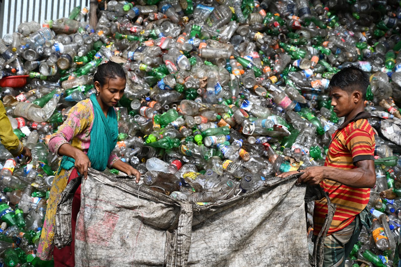 Workers sorting plastic bottles at a recycling facility in Chattogram, Bangladesh.